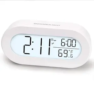 Cadeau de décoration prêt à expédier Horloge de table de bureau ovale moderne Corps lit Réveil LCD numérique avec rétro-éclairage LED