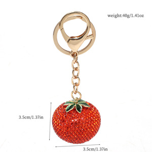 Meilleure vente : Boutons de manchette de luxe léger entièrement ornés de strass, motif kaki, pour filles, avec pendentif porte-clés de sac de voiture en forme de fruit, sensation haut de gamme, style sportif - Product Image 5