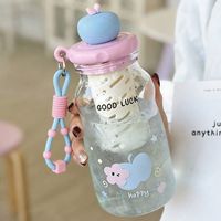 Bouteille d'eau mignonne avec motif de chien de dessin animé sur le couvercle en forme de pomme