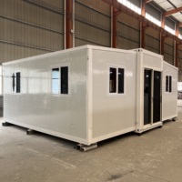 Maison conteneur moderne extensible, respirante, coupe-vent et imperméable, avec structure noire et jaune désert, de 20 et 40 pieds, idéale pour cuisine ou salle de sport