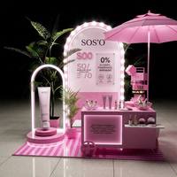 Kiosque mobile rose personnalisé avec éclairage LED pour la promotion d'événements de marques de soins de la peau et de cosmétiques