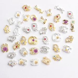 De alta calidad de diamantes de imitación para las uñas 3d oro kawaii clavo de metal encantos accesorios para uñas - Product Image 1