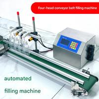 Machine de remplissage à 4 têtes de petite taille avec convoyeur pour huiles essentielles, parfums, désinfectants pour les mains, savons liquides, cosmétiques