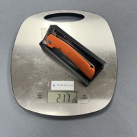 Couteau de poche EDC à lame D2 de forme plate, couteau de survie et de camping ultra-affûté, couteau à ouverture assistée avec manche G10 orange et noir