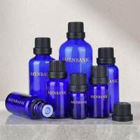 Vente en gros de flacons cylindriques en verre bleu anti-UV pour huiles essentielles, surface givrée, pipette compte-gouttes noire, col 18-415, personnalisable
