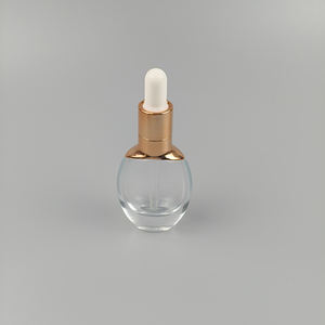 Proveedor ODM/OEM, Botella de Vidrio Transparente Cilíndrica de 20ml/30ml para Cosméticos con Gotero Dorado de PP - Product Image 1