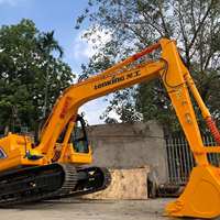 Excavatrice hydraulique CDM6135N 74 kW pour travaux de terrassement avec godet de 0,56 m³, marteau brise-roche et système de conduites pour terrassement