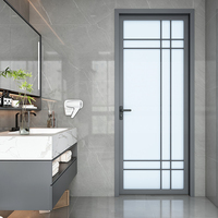 Porte battante en verre au design moderne avec matériau en alliage d'aluminium coupe-vent pour décoration intérieure d'hôtel