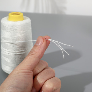 Spun <b>Polyester</b> <b>Yarn</b> 100% White Open End High Tenacity For Packaging And Construction Use - Product Image 1
