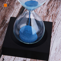 Vente en gros unique cadeau souvenir promotionnel sablier de Noël en bois de verre moderne avec socle magnétique en bois noir