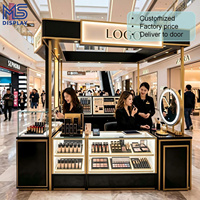 Comptoir de présentation de parfums rond, îlot ovale avec éclairage LED, finition en acier inoxydable doré, pour magasin de détail, centre commercial, kiosque, taille personnalisée