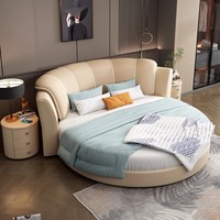 Lit rond king size en cuir blanc de bonne qualité, rembourré, design moderne minimaliste, chambre principale, style hôtel