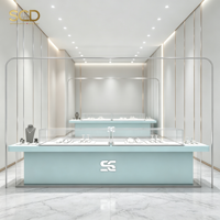 Vitrine de présentation de bijoux de luxe sur mesure en verre trempé, merchandising visuel, émail cuit écologique pour la décoration intérieure de magasins de détail