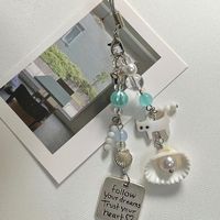 Nouveau design original, petit pendentif coquillage chat d'été, chaîne de téléphone portable, chaîne d'appareil photo, cadeau, ornement suspendu pour la maison, porte-clés