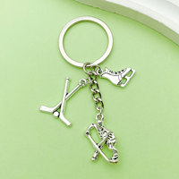 Porte-clés en métal léger et durable, motif puck de ski et hockey, pour les amateurs de sports d'hiver, cadeau et souvenir de compétition