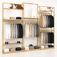 Présentoir mural multi-emplacements en métal noir pour vêtements, avec plateforme pour mannequin et étagère en bois, usage commercial