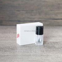 Bouteille d'huile pour cuticules de forme ronde transparente personnalisée de 15ml bouteille vide de vernis à ongles pour huile pour cuticules avec capuchon noir et brosse