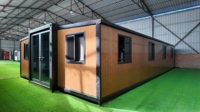 Maison préfabriquée élégante, polyvalente, pliable et extensible, écologique, isolée thermiquement, cabine mobile dépliable de 20/30/40 pieds pour complexe hôtelier
