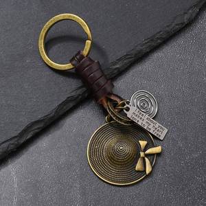 Accesorios de tejido genuinos para colgar en bolsos, regalos al por mayor, colgante de lazo retro para sombrero de paja, llavero de metal - Product Image 1