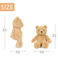 Ours en peluche avec des oreilles rondes, un nez brun et des pattes arrondies pour des présentations classiques d'ours en peluche