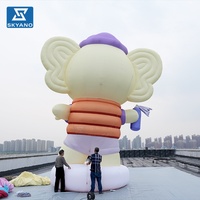 Modèle d'éléphant gonflable géant personnalisé avec lunettes pour événements commerciaux en plein air, décoration publicitaire pour centre commercial