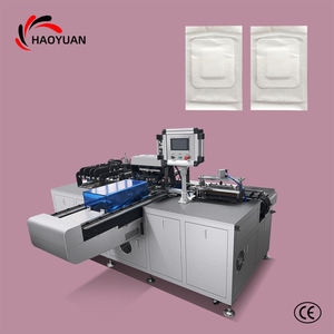 Machine d'emballage entièrement automatique et personnalisée à double poussée pour gants, kits jetables quatre pièces et autres produits - Product Image 1