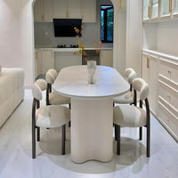 Table à manger ovale de luxe contemporaine et 4 chaises avec plateau en pierre finition lisse, base colonnale unique pour intérieurs modernes