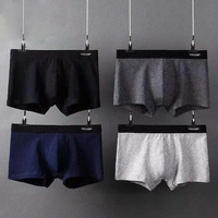 Boxer taille moyenne personnalisé pour hommes Ceinture élastique Motif brodé Conception sans couture. RTS Bulge Pouch Sous-vêtements de base pour homme
