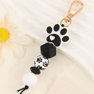 Silicone Cat Paw Beaded <b>Keychain</b> Fluffy Pom-Pom Wood Beads Handcrafted Light Keyring Accessory with Woven Technique - Product Image 3