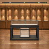 Ensemble de vitrines de présentation de bijoux de style chinois, îlot central en verre avec cadre noir pour l'exposition de parfums et cosmétiques en showroom
