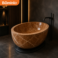 Baignoire ovale autoportante en marbre brun veiné blanc, base foncée polie, pour salle de bain moderne et luxueuse