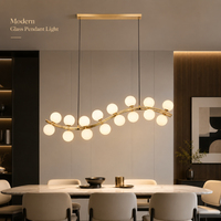 Lustre Linéaire Moderne Contemporain en Verre Blanc avec Cadre Ondulé Doré et Bulles G9 pour Table à Manger Longue, Salon et Cuisine - Vente en Gros