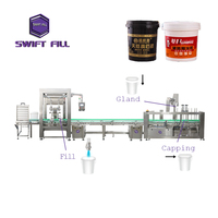 Ligne de production de pesage et de remplissage à double tête contrôlée par PLC de haute précision pour les flacons de boissons en verre avec bouchage automatique
