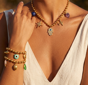 Conjunto de Joyería Bohemia con Cuentas Doradas, Collar y Pulsera con Dijes Mixtos de Cruz, Palma y Ojo para Mujer - Product Image 1