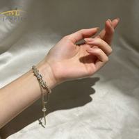 Chaîne de main JML plaquée or 14 carats avec nœud et cœur en zircon |   Bracelet de doigt ajustable, bijou fantaisie ajustable