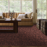 Un tapis brun vintage à motif floral oriental, un tapis traditionnel à bordures, adapté au salon