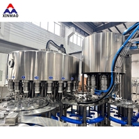 Machine de remplissage automatique d'eau pure minérale en bouteille PET, capacité 10000 BPH, pour bouteilles de 2 L