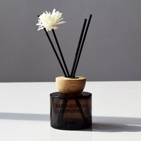Bouteille diffuseur d'arômes en verre rond noir mat 100ml 120ml en stock, bouteille d'aromathérapie sans flamme avec bouchon et bâtonnets en bois