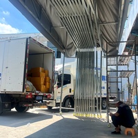 Tente rétractable motorisée résistante aux UV en PVC avec structure en acier galvanisé et roues pour atelier d'usine - Toutes saisons