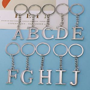 Venta al por mayor de fábrica, se pueden personalizar 26 letras inglesas, accesorios que no se desvanecen, colgante de llavero hueco de acero inoxidable - Product Image 1