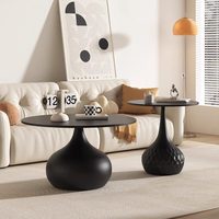 Table basse design en métal et pierre pour petit appartement, combinaison créative pour salon, table d'appoint noire haut de gamme pour canapé