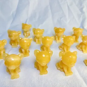 Vente en gros de haute qualité sculpture sur cristal Simba lion roi lion anime calcite jaune Simba sculpture pour cadeau