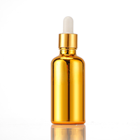 Flacon compte-gouttes en verre plaqué or et argent sur mesure avec pipette à bulbe en caoutchouc pour emballage cosmétique d'huiles essentielles et sérums