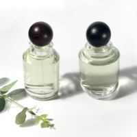 Haute qualité personnaliser bouchon clair plat rond parfum bouteille en verre bouteille d'huile essentielle bouteille de parfum de luxe 100ml