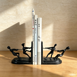 Moderne Kinder-Zerrkampf-Buchstützen aus Gusseisen, Metall-Handwerk, Schreibtisch-Ornament, Umweltfreundliche Einzigartige Studierzimmer-Dekoration, Einweihungsgeschenk - Product Image 1