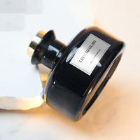 Diffuseur d'arômes rond noir de luxe de 180 ml avec bouchon en liège et roseau, design élégant, populaire dans un emballage en carton