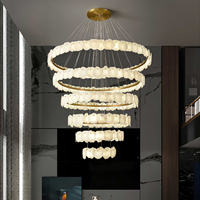 Lustre en acier doré et albâtre, luminaire suspendu à plusieurs niveaux pour plafond haut, hall d'hôtel, escalier, villa, personnalisable