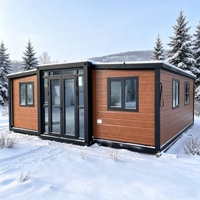 Maison modulaire en conteneur de 20 pieds avec panneaux sandwich et système d'énergie solaire pour logement de bureau