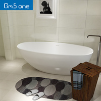 Baignoire ovale autoportante de luxe au design moderne en pierre artificielle massif, neuve, capacité 1 personne, pour hôtel, avec drain intégré