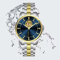 Montre mécanique squelette élégante bicolore unisexe avec bracelet en acier inoxydable, étanche, verre et décoration moderne en relief